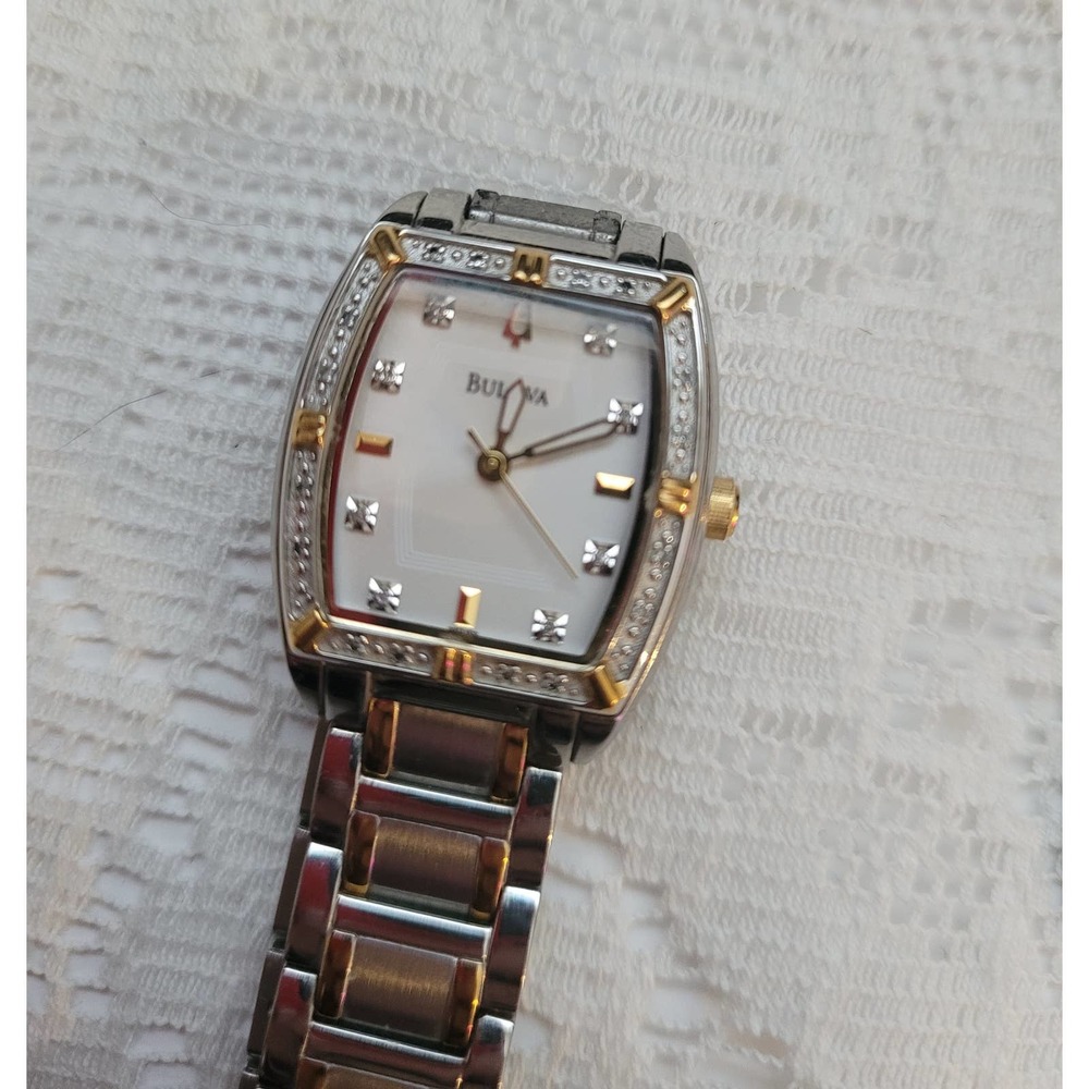 Authentic Woman's Bulova watch with diamond bezel, 2 toned.